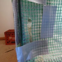 A small, 2-inch (5cm) slit for passive air intake, covered with mesh to prevent bugs from entering. I know, it's a sloppy tape job...but it works.