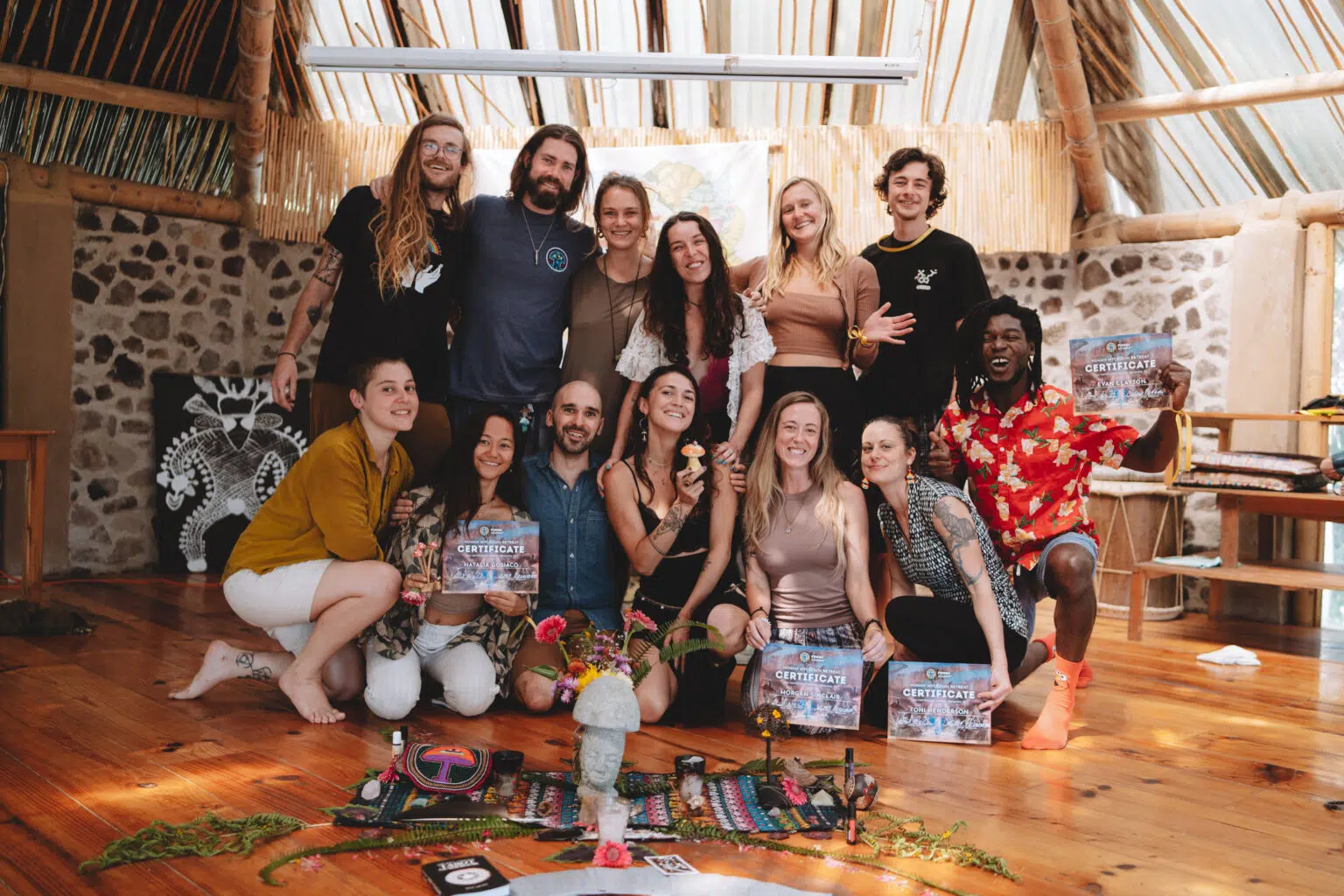 Human Mycelium Retreat participants celebrating together with their certificates at Fungi Academy